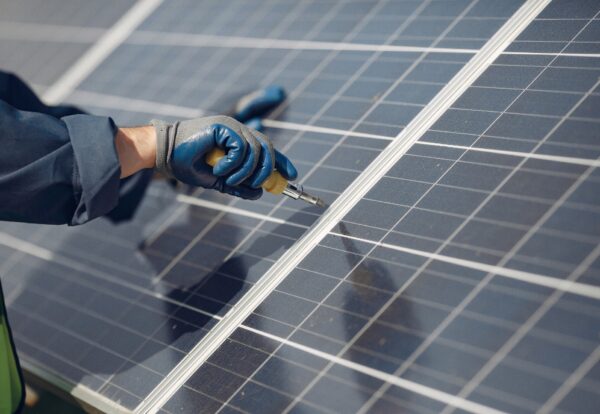 man-with-white-helmet-near-solar-panel_1157-29976